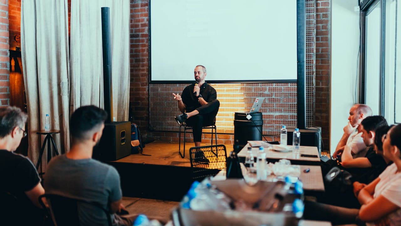 public speaker setting and speaking with a microphone.